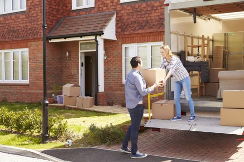 Professional movers handling apartment furniture in Highbury