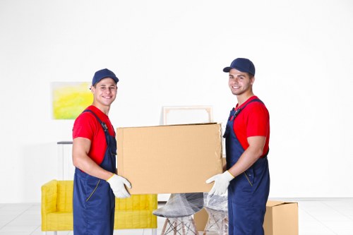 Removal team preparing a local move in Highbury with furniture and boxes