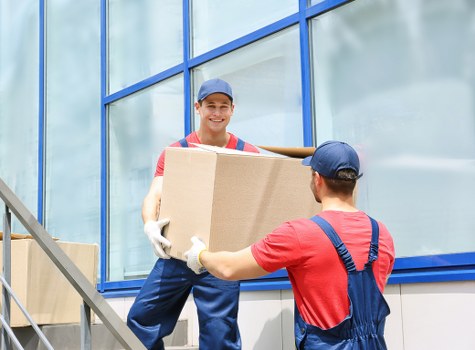 Furniture removals team planning a move in Highbury street with careful loading