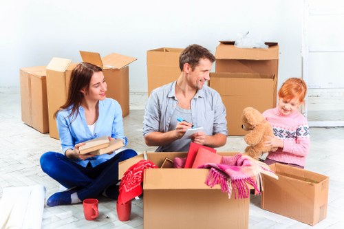 Household items being prepared for transport by moving truck