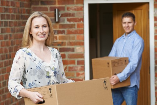 Unpacking boxes and organising rooms in a Highbury property