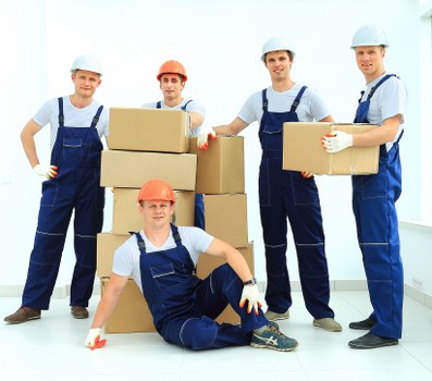 Local packing team preparing fragile household items in Highbury